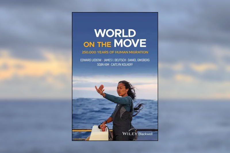 Book cover with title: World on the Move: 250,000 Years of Human Migration. Edward Liebow, James I. Deutsch, Daniel Ginsberg, Sojin Kim, Caitlyn Kolhoff. Below the text, a photo of a person aboard a ship at sea, holding one palm out toward the horizon, as if using it to navigate.