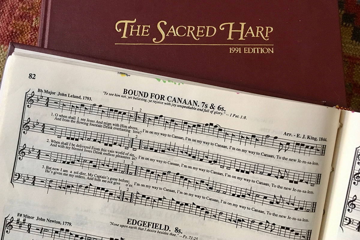 Closeup of a page of musical notation from the book The Sacred Harp, 1991 Edition.