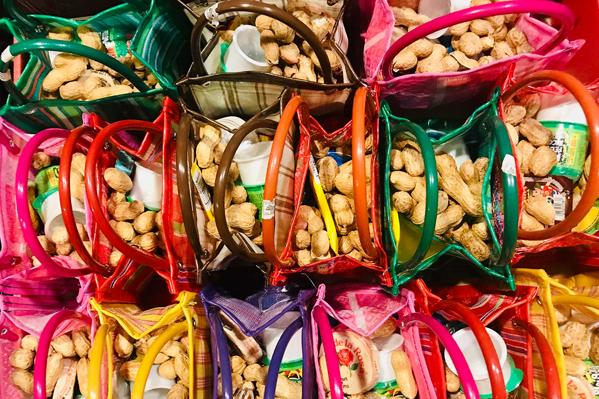 From above, several colorful bags packed with peanuts and packaged food treats.