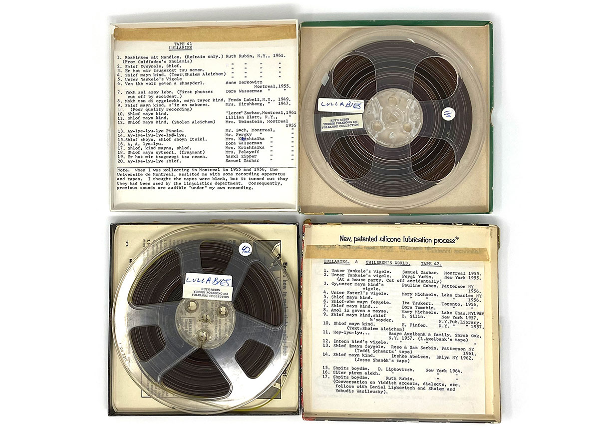 Two open boxes of analog tape with printed liner notes in Yiddish and English.