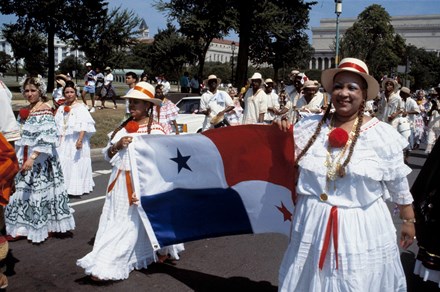 Women carry the Panamanian flag at the 1993 Latin American Festival in Washington, D.C.