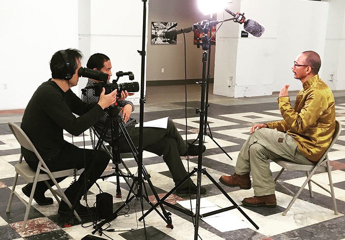 Conducting the interview with Shide Nyima in the Smithsonian's Arts and Industries Building. Photo by Zoe Tribur