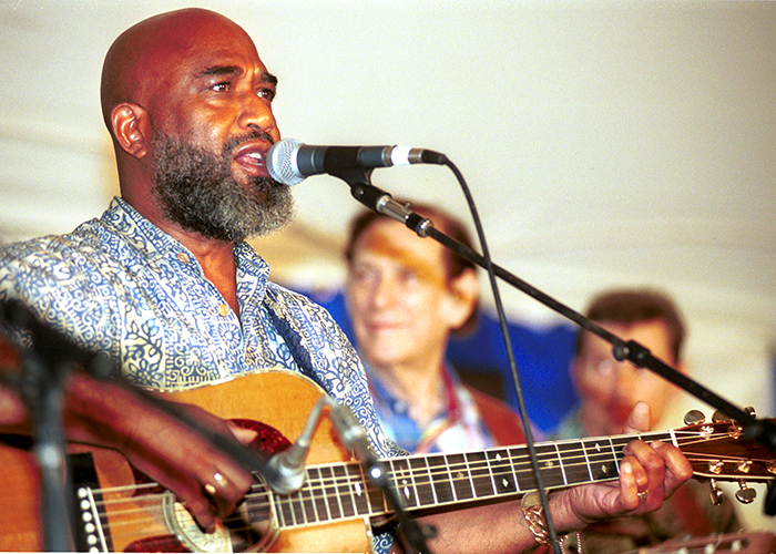 Josh White Jr. performs in the evening concert Folk Songs of the Presidency, with Oscar Brand and Joe Glazer at the 2001 Smithsonian Folklife Festival. Photo by Harold Dorwin, Ralph Rinzler Archives