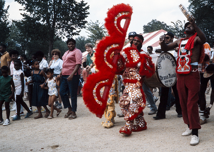 The Young Tuxedo Brass Band processes through the 1985 Folklife Festival. Photo by Brenda Gilmore, Ralph Rinzler Folklife Archives