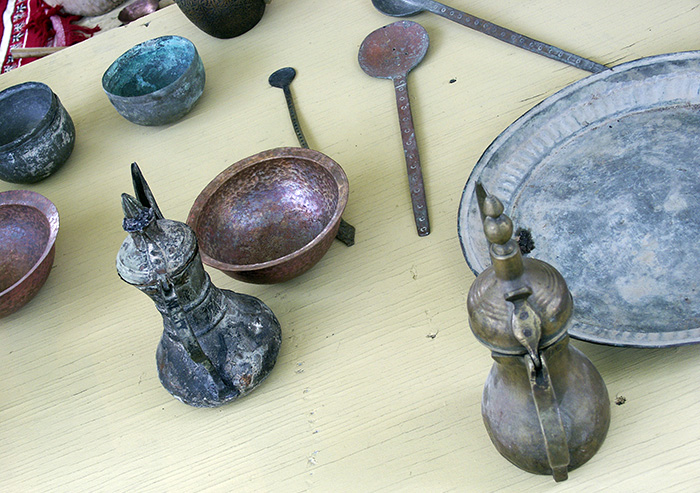Two Omani coffee pots among other metalwork at the 2005 Festival. Photo by Joe Gayer, Ralph Rinzler Folklife Archives