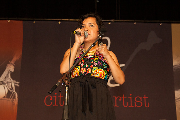 Martha González performs at a 2014 Folklife Festival concert celebrating the life and legacy of Pete Seeger. Photo by Brian Barger, Ralph Rinzler Folklife Archives